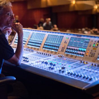 Canva - Man Sitting in Front of Audio Mixer